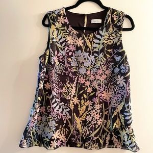 Beautiful Calvin Klein top with rich pastels on black background.